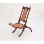 VICTORIAN CARVED WALNUT CHILD?S STEAMER CHAIR, of typical form with foliate carved and pieced top