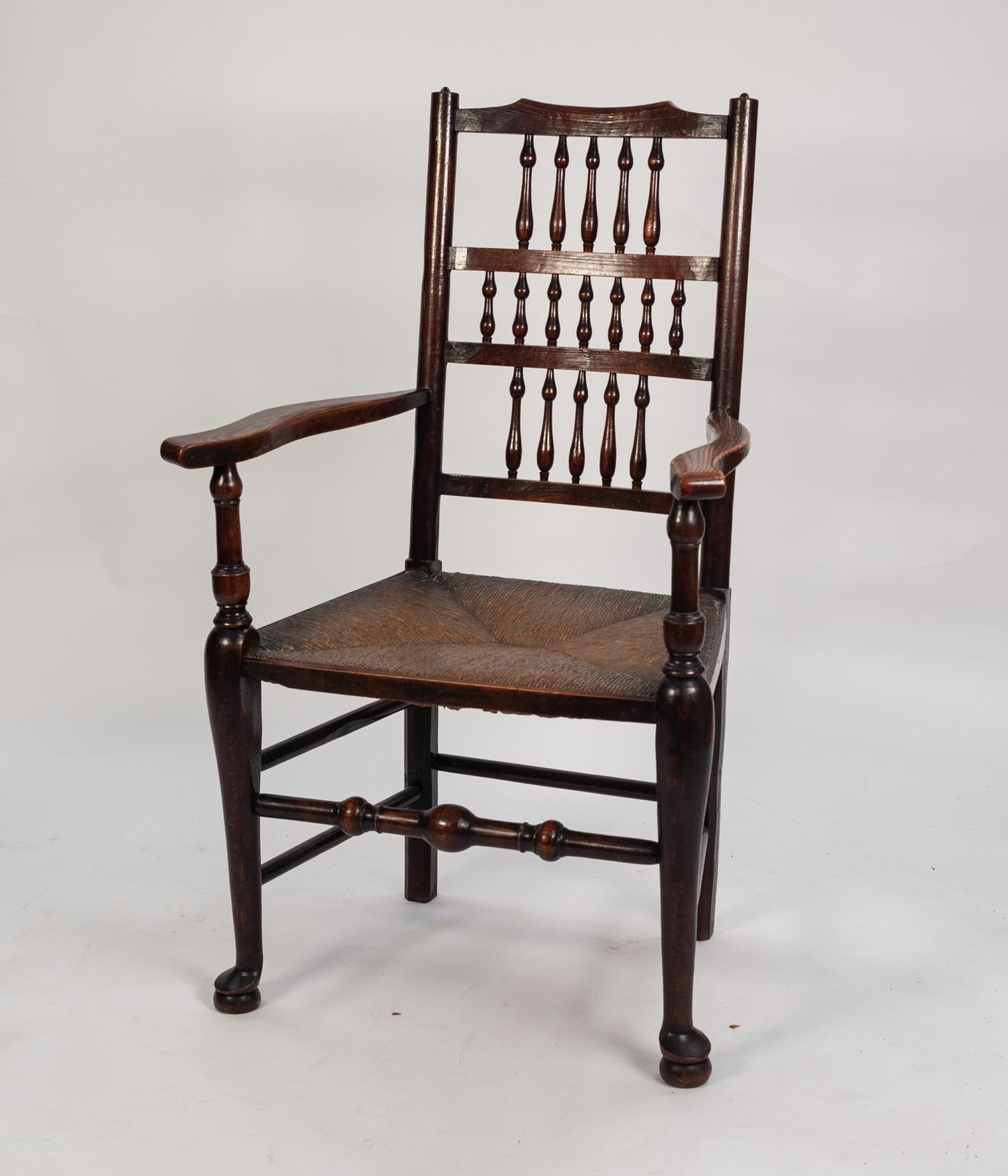 NINETEENTH CENTURY ELM AND FRUITWOOD SPINDLE BACK OPEN ARMCHAIR, the back with seventeen spindles in