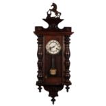 LATE 19th CENTURY STAINED BEECHWOOD VIENNA STYLE WALL CLOCK with spring driven movement, with
