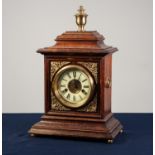 EARLY 20th CENTURY GERMAN WALNUT CASED MANTEL CLOCK, the movement striking on a coiled gong, the