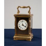 EARLY TWENTIETH CENTURY FRENCH BRASS CASED CARRIAGE CLOCK, of typical form with circular Roman