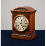 EDWARDIAN CARVED OAK CASED MANTEL CLOCK, the movement striking on a coiled gong, with a silvered