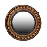 REGENCY GILTWOOD FRAMED CIRCULAR CONVEX WALL MIRROR, in a moulded frame with reeded slip, moulded ?