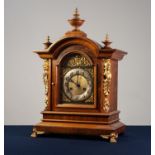 EARLY 20th CENTURY WALNUT AND GILT SPELTER CASED MANTEL CLOCK, the Junghans movement striking on