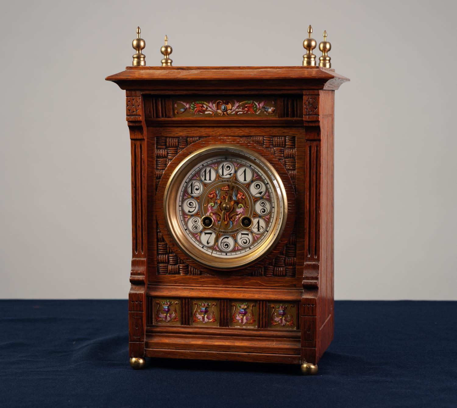 LATE 19th CENTURY OAK CASED MANTEL CLOCK in the Aesthetic taste inset with 'grotesque' painted