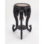 NEAR EASTERN CARVED BLACK WOOD AND MARBLE JARDINIERE STAND, the moulded circular top with red veined