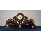 UNUSUAL CARVED WOODEN AND PARCEL EBONISED MANTEL SELF OR OVER-DOOR ORNAMENT in the form of two