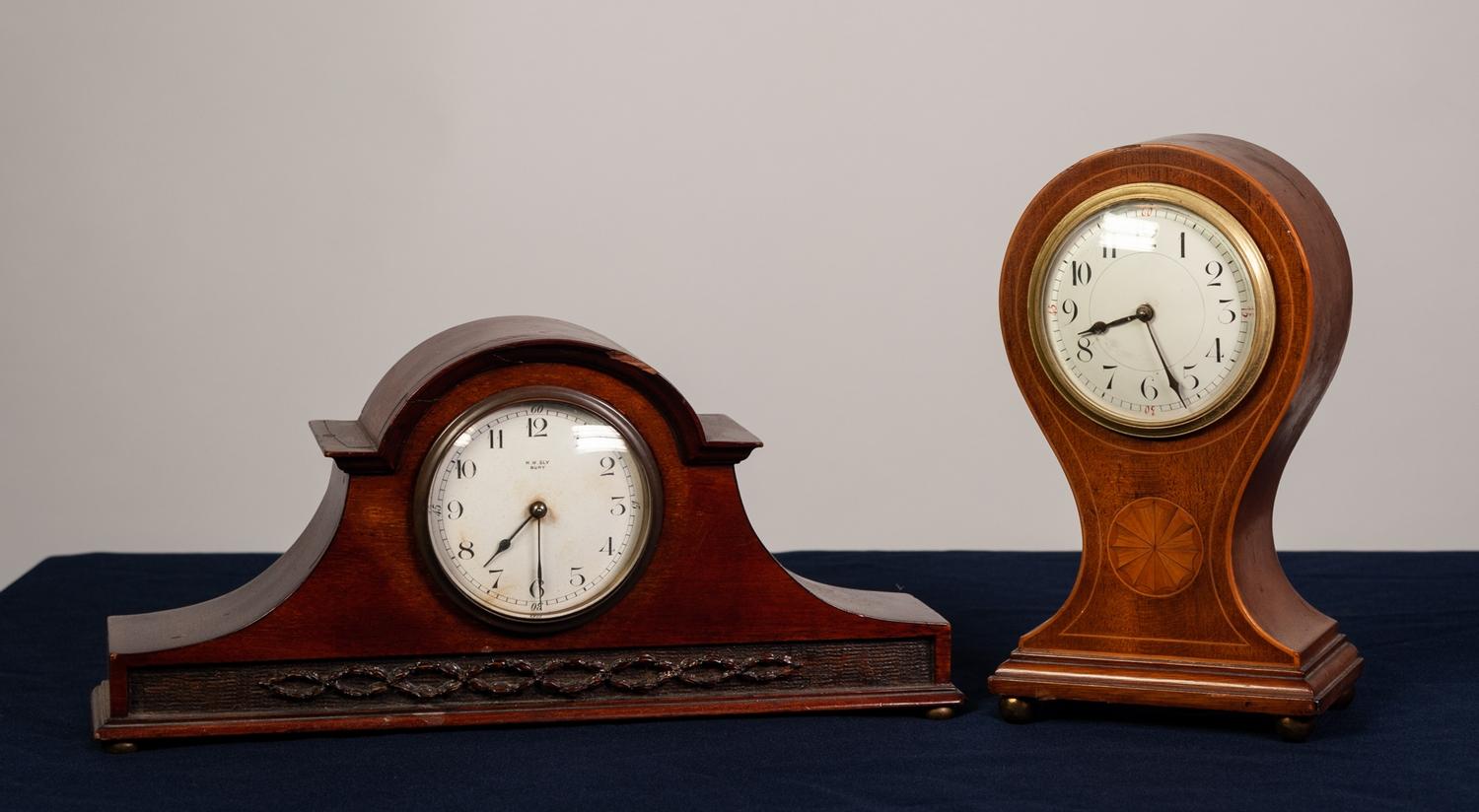 EDWARDIAN INLAID MAHOGANY BALLOON SHAPED MANTEL CLOCK with fan patera and string inlay, drum