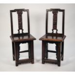 PAIR OF ANTIQUE CHINESE CARVED AND DARK STAINED ELM MARRIAGE CHAIRS, each with scroll and floral