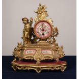 FRENCH, EARLY 20th CENTURY GILT SPELTER FIGURAL MANTEL CLOCK with drum shaped movement having pink