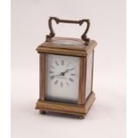 TINY 20th CENTURY FRENCH CORNICHE CASED BRASS CARRIAGE CLOCK, the white enamel dial marked 'Made