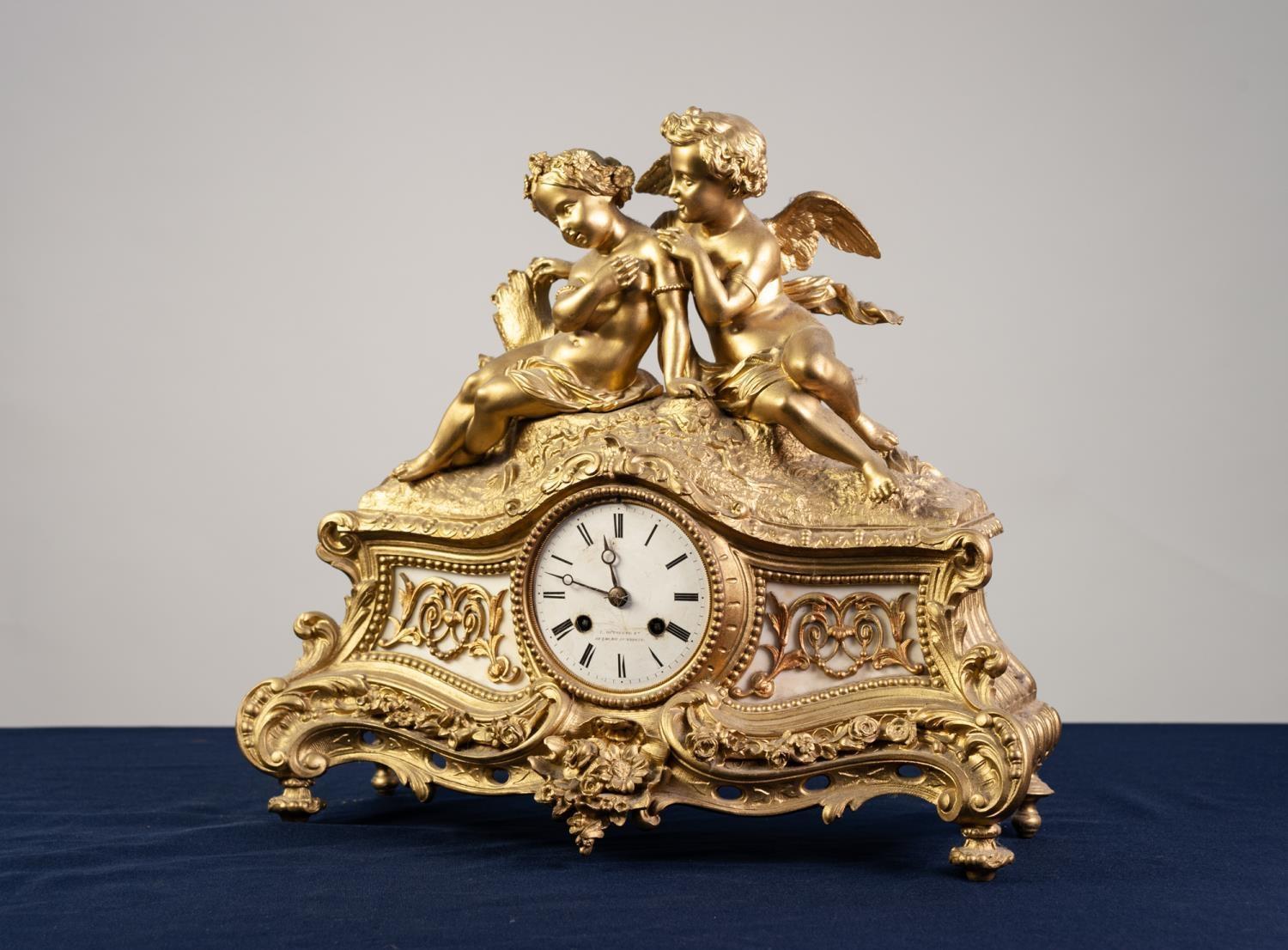 19th CENTURY FRENCH ORMOLU ALABASTER INSET CASED MANTEL CLOCK, the white enamel roman dial inscribed