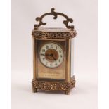 CIRCA 1900 FRENCH SERPENTINE CORNICHE CASED BRASS CARRIAGE CLOCK with pierced rocaille-work