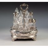 EARLY VICTORIAN SILVER CONDIMENT CRUET TO RECEIVE SEVEN BOTTLE oval and cushion sided and embossed