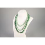 JADE BEAD NECKLACE, of uniform green jade beads with cloisonné bead spacers, length 49cm and an