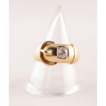 GENT'S EDWARDIAN, HEAVY 18ct GOLD BUCKLE PATTERN RING, the top set with an old cut solitaire