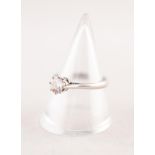 18ct WHITE GOLD RING SET WITH A ROUND BRILLIANT CUT SOLITAIRE DIAMOND, approximately .60ct, 3gms,