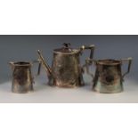 THREE PIECE ENGRAVED ELECTROPLATED TEA SET, of tapering, oval form with angular scroll handles,