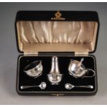 A PRE WAR CASED SILVER CONDIMENT SET, with engine turned borders, Birmingham 1935