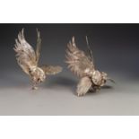 PAIR OF WHITE METAL MODELS OF FIGHTING COCKS, 10 ½? (26.7cm) high, (2)