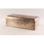 EDWARDIAN PLAIN SILVER TABLE CIGARETTE BOX oblong with slightly domed top 7" (17.8) wide, London