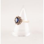 9ct GOLD SYNTHETIC SAPPHIRE CLUSTER RING. An oval sapphire within a border of round white sapphires,