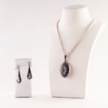 STERLING CHAIN NECKLACE WITH SIAM NIELO WORK OVAL LOCKET PENDANT AND A PAIR OF MATCHING TEAR