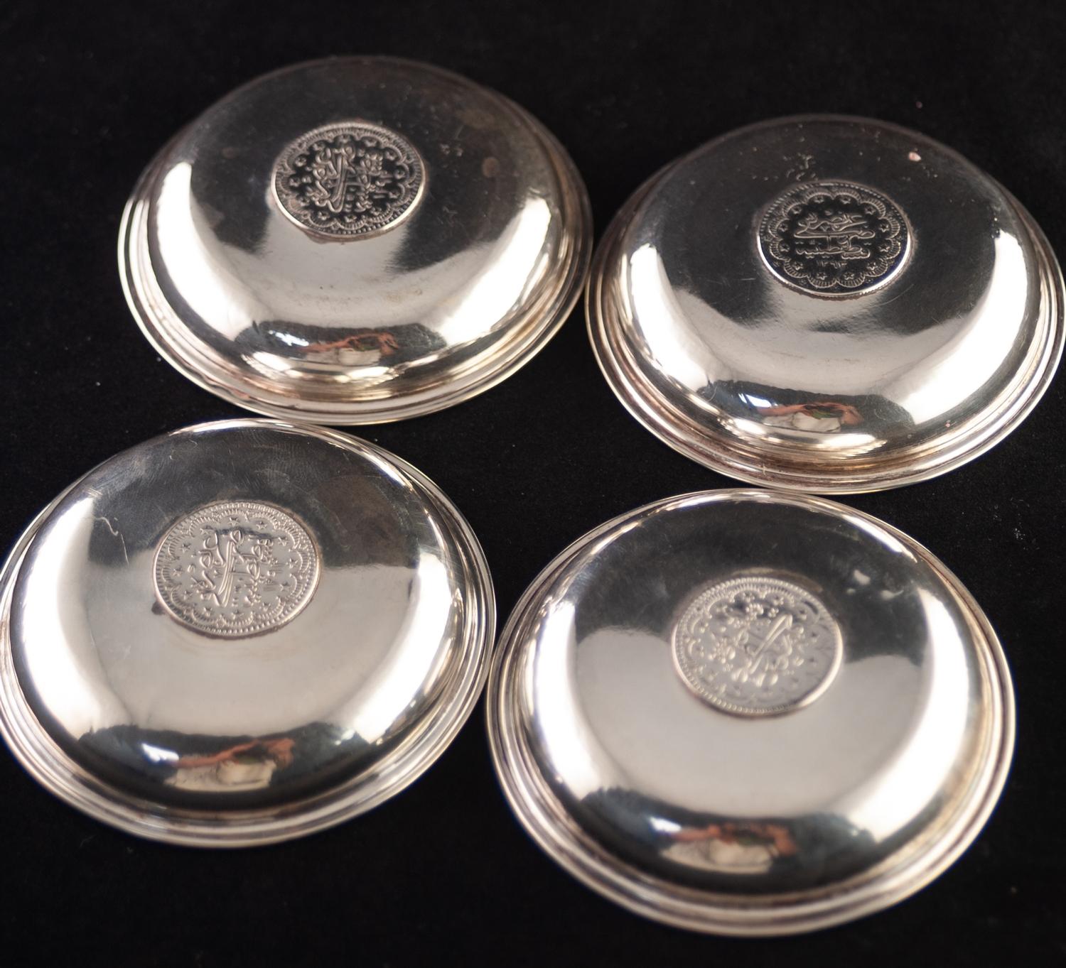 A SET OF FOUR .800 STANDARD CONTINENTAL SMALL CIRCULAR ASHTRAYS, each with a coin inset base, 3" ( - Image 2 of 3
