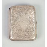 EDWARDIAN SILVER CURVED OBLONG POCKET CIGARETTE CASE, all over engraved with foliate scrolls,