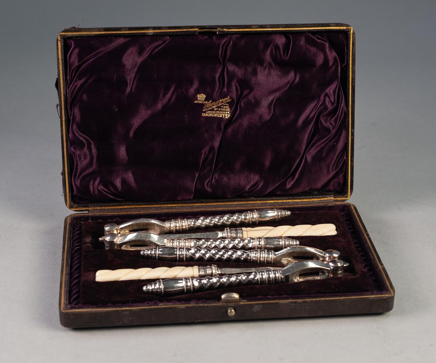 CASED PAIR OF LATE 19th CENTURY ELECTROPLATE NUTCRACKERS with spiral handles and the NUT PICKS