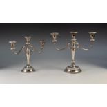 GRADUATED PAIR OF THREE LIGHT ELCTROPLATED CANDELABRA, each with twin scroll arms, circular base and