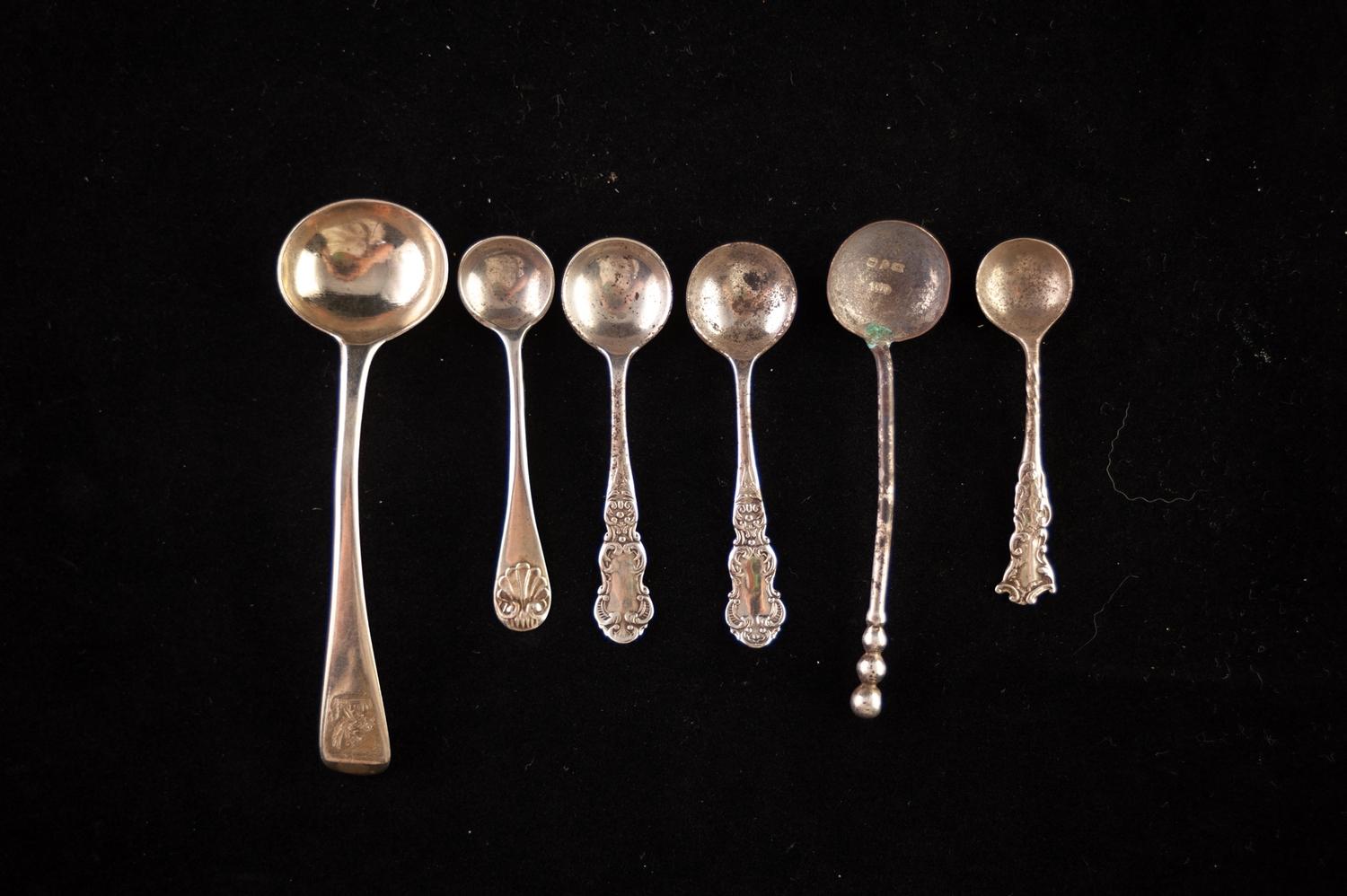 A GEORGE III SILVER SALT SPOON, with crested handle, London 1814, and FIVE OTHER SILVER SALT SPOONS,