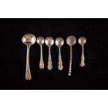 A GEORGE III SILVER SALT SPOON, with crested handle, London 1814, and FIVE OTHER SILVER SALT SPOONS,