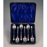 A CASED SET OF SIX SILVER TEASPOONS, with shell embossed terminals, London 1894