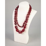 GRADUATED BAKELITE BEAD NECKLACE, of continuous oval beads, length 95cm