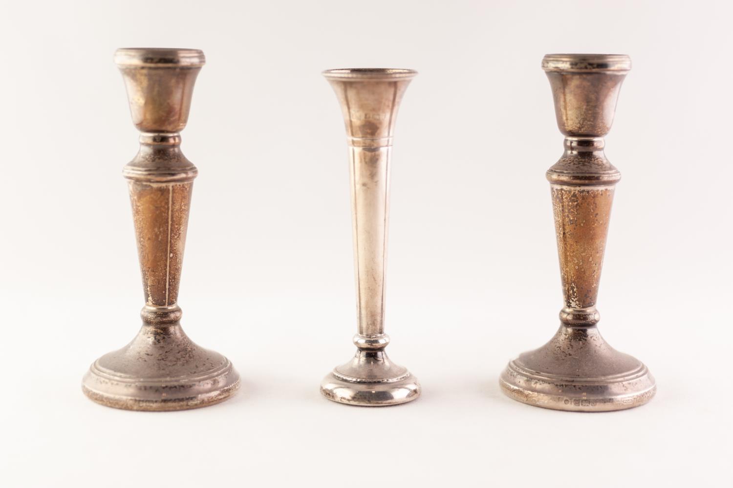 PAIR GEORGIAN STYLE WEIGHTED SILVER CANDLESTICKS with campana shape sconce and tapering stem to