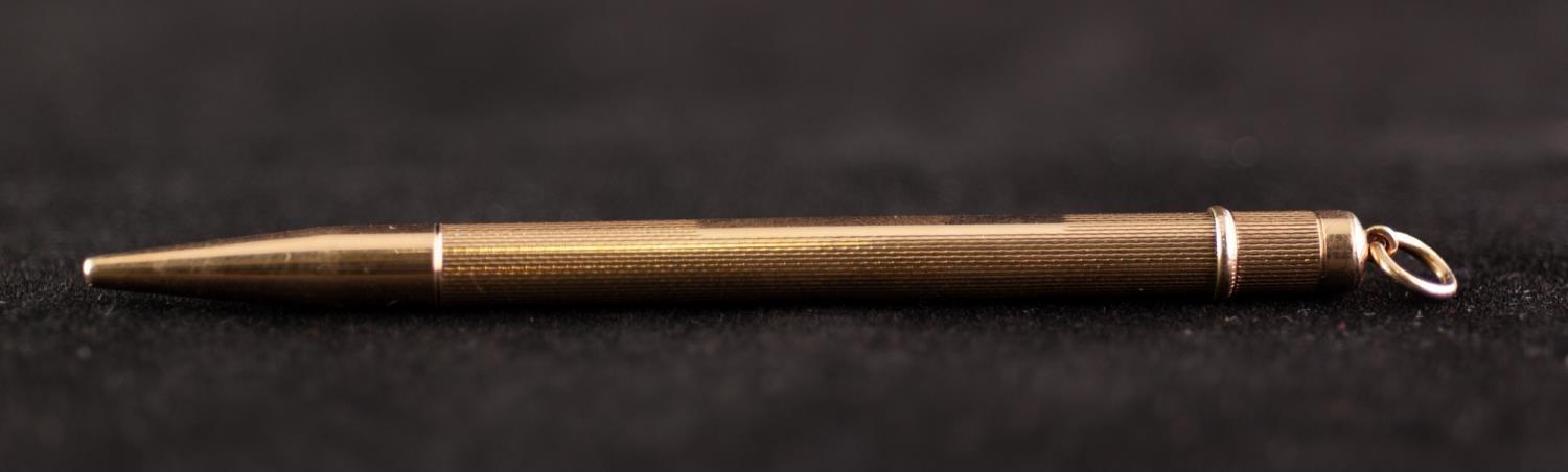 POST WAR 9ct GOLD CASED PROPELLING PENCIL with engine turned decoration and suspension ring, maker - Image 2 of 3