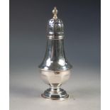 AN EDWARDIAN TWENTIETH CENTURY SILVER SUGAR CASTER, London 1926, 7 3/4" (19.5cm) high 4oz