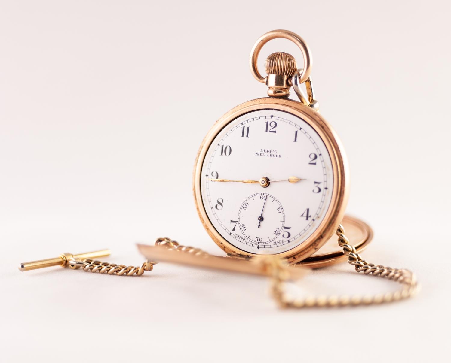 ROLLED GOLD OPEN FACED POCKET WATCH WITH KEYLESS SWISS 7 JEWEL MOVEMENT, white Arabic dial with