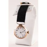 9ct GOLD FOB WATCH with mechanical movement, white Arabic dial, 1" diameter suspended on a black