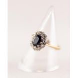 18ct GOLD SAPPHIRE AND DIAMOND OVAL CLUSTER RING set with a centre oval sapphire and surround of