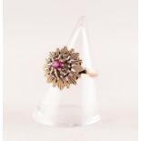 9ct GOLD SYNTHETIC RUBY AND WHITE SAPPHIRE CLUSTER RING. A round synthetic ruby within a cluster