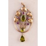 EARLY 20th CENTURY 9ct GOLD ARTS & CRAFTS STYLE OVAL OPEN WORK PENDANT, the centre in the form of