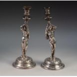 PAIR OF WMF ELECTROPLATED FIGURAL CANDLESTICKS, modelled as Renaissance figures holding cornucopia