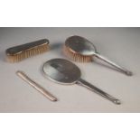 A MODERN ENGINE TURNED SILVER PART DRESSING TABLE BRUSH SET viz HAND MIRROR, HAIR BRUSH AND