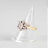 18ct WHITE GOLD AND DIAMOND DAISY CLUSTER RING WITH RAISED CENTRE DIAMOND AND SURROUND OF SMALLER