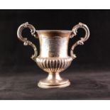 AN EARLY VICTORIAN SILVER TWO HANDLED TROPHY CUP, the campana shape demi-gadrooned body engraved