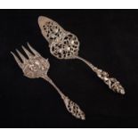 PROBABLY DUTCH EARLY TWENTIETH CENTURY CAST WHITE METAL BREAD SERVING FORK, embossed with fisherfolk