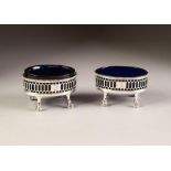 PAIR OF GEORGE III SILVER OVAL SALT CELLARS, one with original blue glass liner, the other a