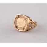 9ct GOLD COIN RING. Inset with a pseudo Victorian coin, with pierced shoulders, ring size M, 4.22g